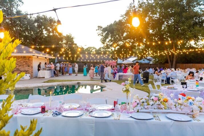 A charming backyard wedding setup with elegant decorations and natural outdoor beauty.