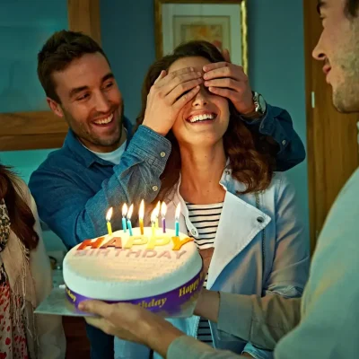 Surprise birthday party with friends and a birthday cake