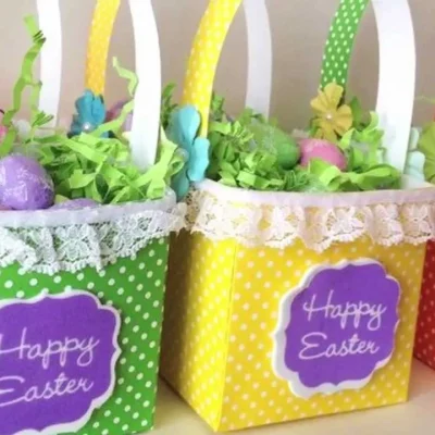 pastel easter basket for adults filled with chocolates candles coffee beans and cozy gifts on spring table